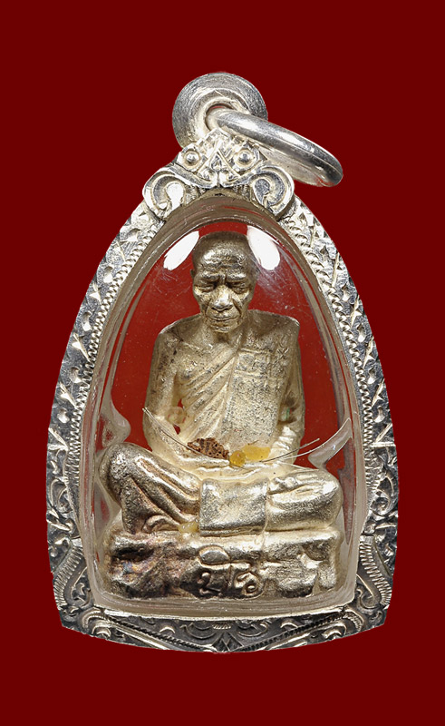 พระกริ่งรูปเหมือนรุ่นแรก หลวงตามหาบัว เนื้อเงินก้นทองคำหมายเลข 1