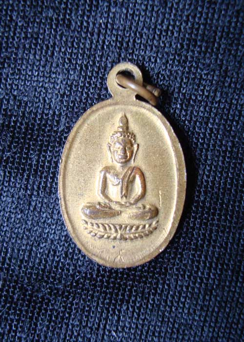 เหรียญพระพุทธหลังนางกวัก ไม่ทราบที่