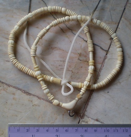 สร้อยงาช้างล้วน   ห่วงกลางทรงกระจับ  เคาะเดียว 