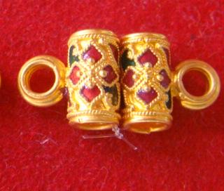 ตะกรุดทองคำ 96.5% สำหรับร้อยสร้อย ลงยา ยาวประมาณ 1 cm นน. 2.9 g (มีห่วง)