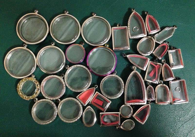 กรอบสแตนเลส มือ2 ใส่พระเกจิ หรือ จตุคาม จำนวน 31 ชิ้น