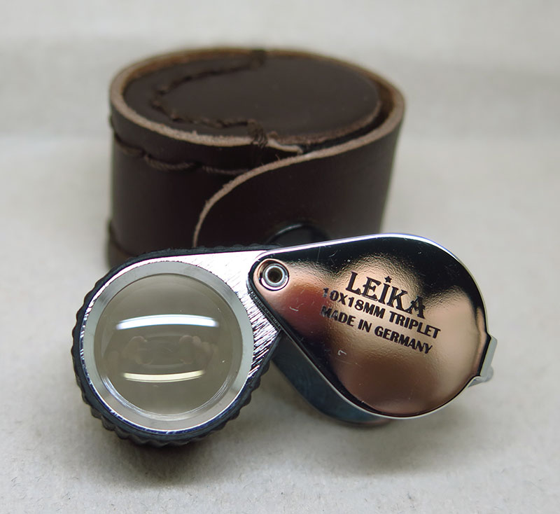 วัดใจ เริ่มเคาะแรก ราคาเบาๆครับ Leika10x18mm สีเงินหุ้มยาง เลนส์แก้ว3ชั้น พร้อมซองหนัง