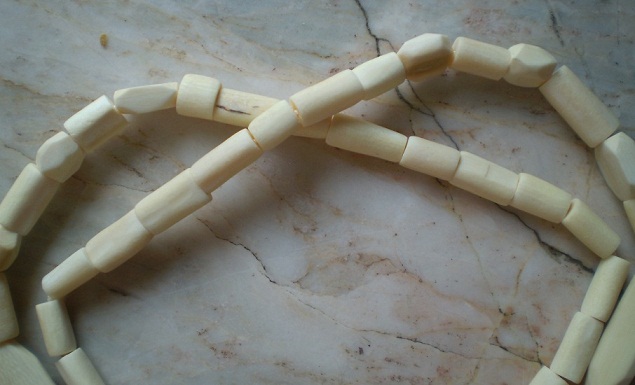 สร้อยงาช้างแท้  งาดิบ  ไม่มีการขัดเงา  ห่วงกลางโค้ง  เคาะเดียว 