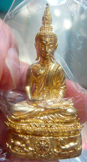 หลวงพ่อจรัญ วัดอัมพวัน พระกริ่ง รุ่นนฤมิตรโชค เนื้อทองทิพย์ ปี พ.ศ. 2554