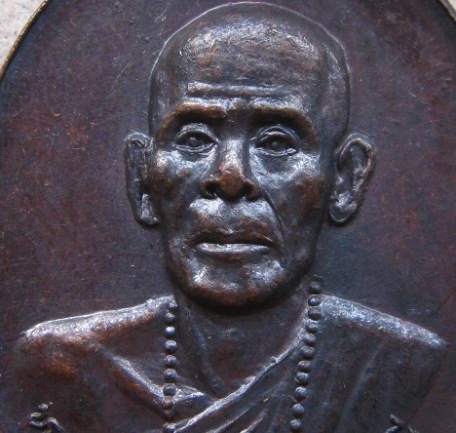 เหรียญรุ่นแรก หลวงปู่คำคะนิง จุลมณี วัดถ้ำคูหาสวรรค์ โขงเจียม จ.อุบลราชธานี ปี2527