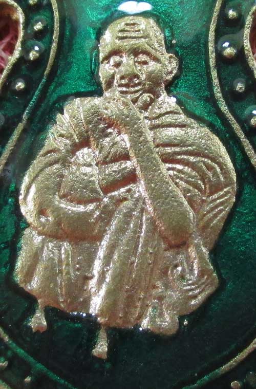 เหรียญเสมา หลวงปู่สรวง รุ่นเเรก วัดป่าดงมะไฟ อ. สังขะ จ.สุรินทร์ ปี 27 เนื้อฝาบาต ลงยาสีเขียว (ตอกโค