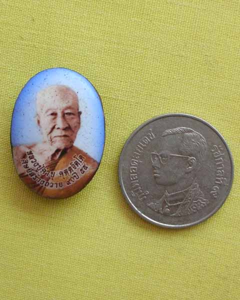ล๊อกเก็ตเล็ก ฉากฟ้า หลวงปูคำบุ คุตฺตจิตฺโต หลังตะกรุดเงินและแร่ไหลตาน้ำ วัดกุดชมภู จ.อุบลฯ**A1**