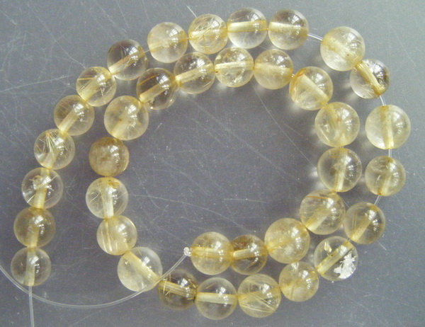 เม็ดหิน "แก้วไหมทอง" ขนาด 7 ม.ม. จำนวน 35 เม็ด สำหรับใช้ประกอบร้อยสร้อย