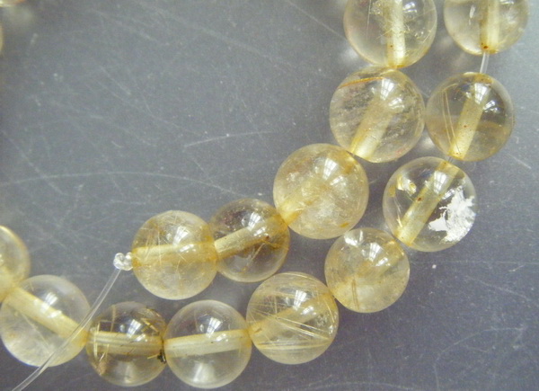 เม็ดหิน "แก้วไหมทอง" ขนาด 7 ม.ม. จำนวน 35 เม็ด สำหรับใช้ประกอบร้อยสร้อย