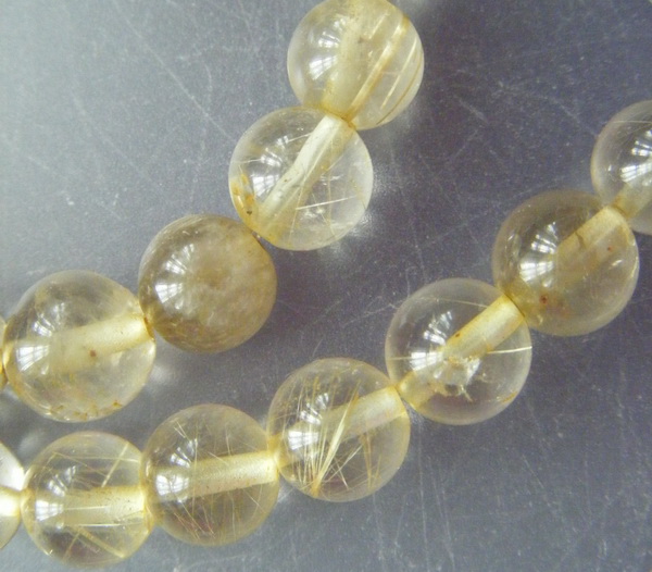 เม็ดหิน "แก้วไหมทอง" ขนาด 7 ม.ม. จำนวน 35 เม็ด สำหรับใช้ประกอบร้อยสร้อย