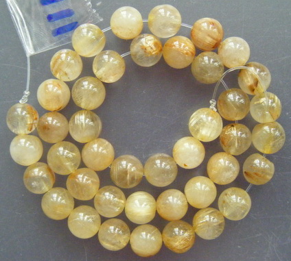 เม็ดหิน "แก้วไหมทอง" ขนาด 7 ม.ม. จำนวน 40 เม็ด สำหรับใช้ประกอบร้อยสร้อย