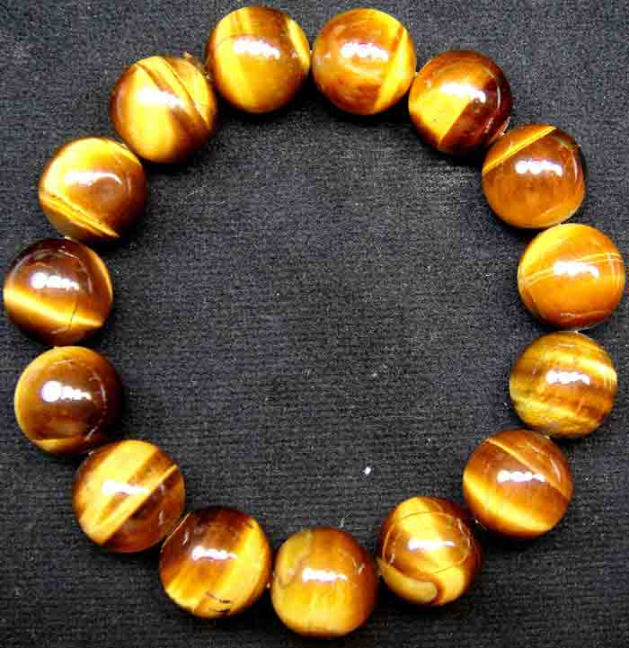 สร้อยข้อมือ พลอยหินตาเสือ (Tiger 's Eye) ขนาดเส้นผ่านศูนย์กลางวงสร้อย 5.5 ซม. เม็ดกลม 15 มิล เกรด A 