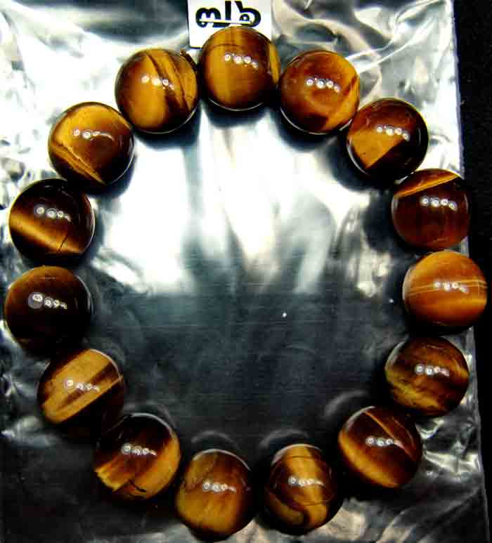 สร้อยข้อมือ พลอยหินตาเสือ (Tiger 's Eye) ขนาดเส้นผ่านศูนย์กลางวงสร้อย 5.5 ซม. เม็ดกลม 15 มิล เกรด A 