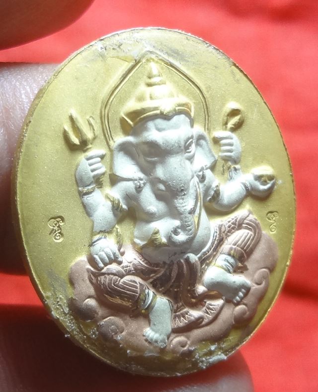 : เหรียญพระพิฆเนตรหลังพ่อแก่หลวงพ่อพูลสามกษัตร์