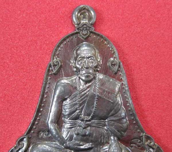 เหรียญตะกั่วมีจารเพชรกลับหลวงปู่คำบุ คุตฺตจิตฺโต วัดกุดชมภู อ.พิบูลฯ จ.อุบลราชธานีแชมป์สายอิสาน