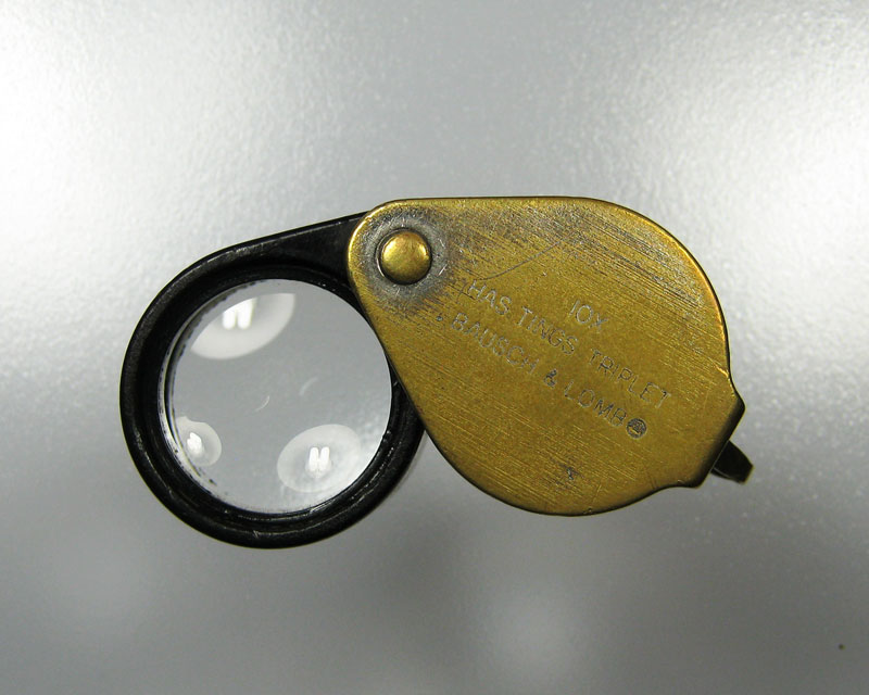 bausch & lomb 10x สามเหลี่ยมเล็ก ตัวรุ่นแรก สามเหลี่ยมขึ้น หลังเรียบ