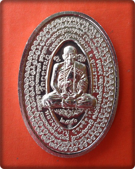 เหรียญเปิดโลกหมื่นยันต์ รุ่นโคตรเศรษฐีรับทรัพย์ เนื้ออัลปาก้า หลวงปู่คำบุ หมายเลข ๙๖๓
