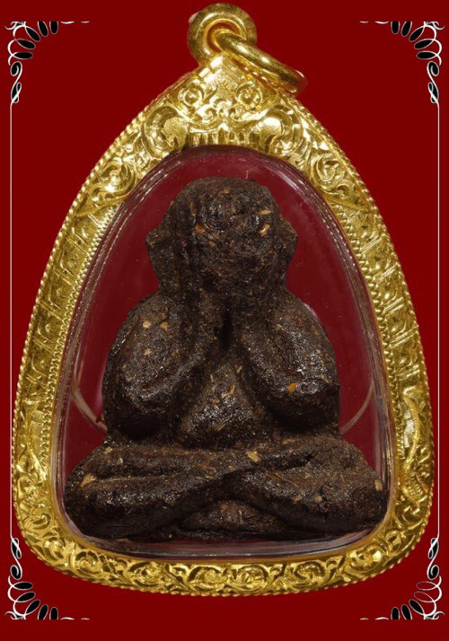 พระปิดตาหลังโค้ตอุเนื้อผงเกษรหลวงปู่คำพัน