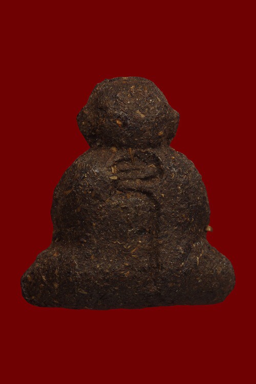 พระปิดตาหลังโค้ตอุเนื้อผงเกษรหลวงปู่คำพัน