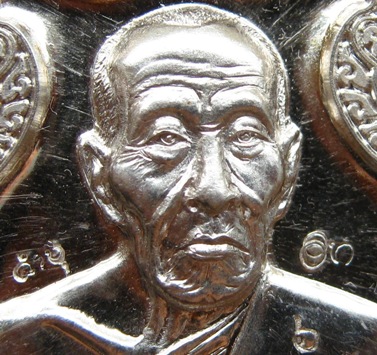 เหรียญอาร์มตำรวจ หลวงปู่คำบุ คุตฺตจิตโต วัดกุดชมภู จ.อุบลราชธานี เนื้อเงิน หมายเลข6 ตอกโค้ด