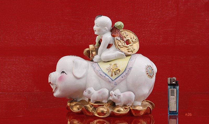 ตุ๊กตาเด็กขี่หมู กองทองคำ ของเมืองจีน