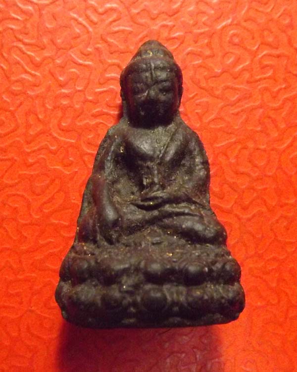 พระกริ่งเนื้อผงรุ่นแรก หลวงปู่คำพัน ปี2518 ผงคลุกรักดำ