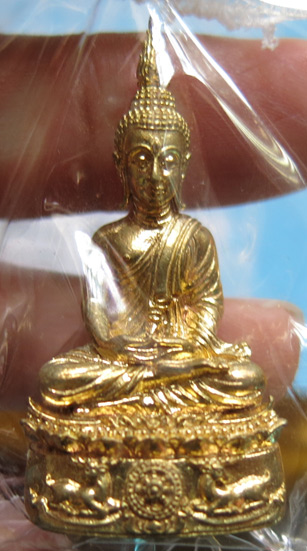 หลวงพ่อจรัญ วัดอัมพวัน พระกริ่ง รุ่นนฤมิตรโชค เนื้อทองทิพย์ ปี พ.ศ. 2554