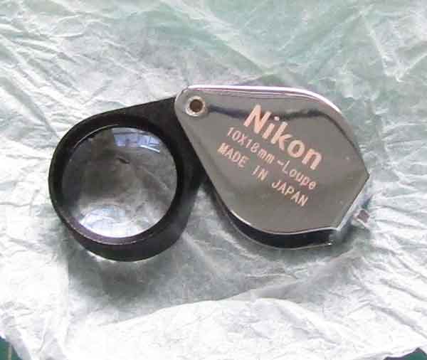 กล้องส่องพระ NIKON Full HD 10x18mm บอดี้สีเงิน พร้อมซองหนัง (มือ1) ใหม่แกะกล่อง