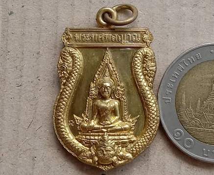 เหรียญพระทศพลญาณ หลังพระพิฆเนศวร์ เจ้าคุณธงชัย วัดไตรมิตรฯ กรุงเทพฯ ปี2549 เนื้อทองฝาบาตร มีโค้ด