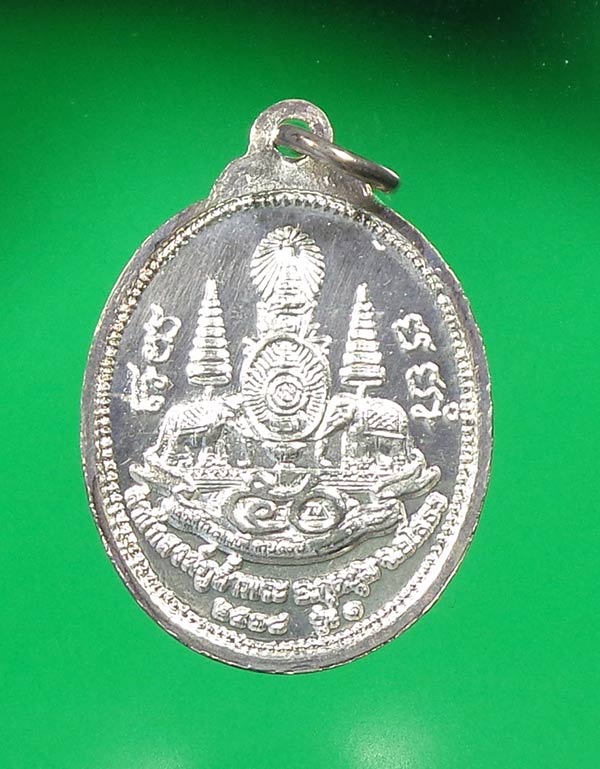 เหรียญเนื้อเงิน รุ่นแรก  หลวงพ่อโอภาสี สร้างสำนักสงฆ์ภูถ้ำพระ ยโสธร ปี 2538