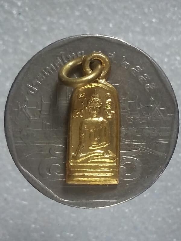 เหรียญพระพุทธหลังนางกวัก ไม่ทราบที่