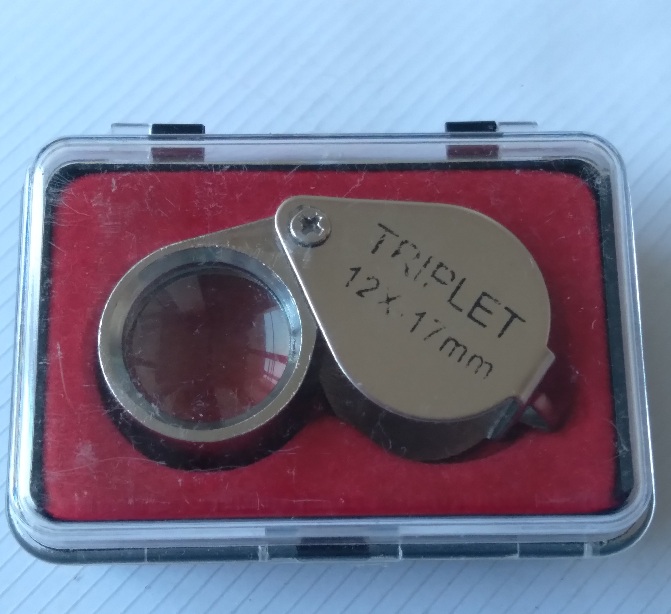 กล้องส่องพระยี่ห้อ triplet ขนาด12×17mm.