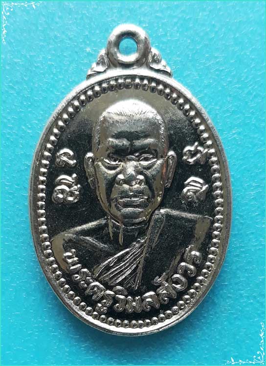 ..พระครูวิมลสังวร วัดแค สพ. เหรียญครึ่งองค์ กะไหล่เงิน หลังยันต์ ปี 34..