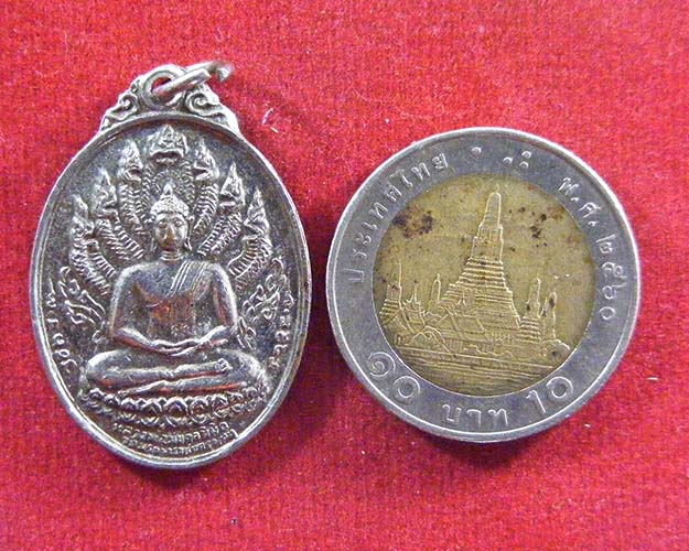 เหรียญนาคปรก หลวงพ่อมงคลนิมิต รุ่นสร้างพระธาตุพนม ปี19