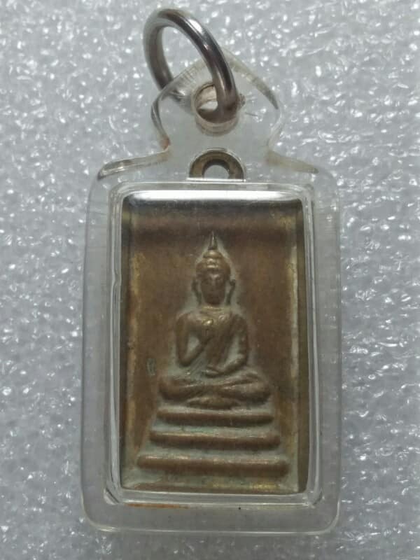 เหรียญพระพุทธหลังยันต์ เลี่ยมพลาสติก ไม่ทราบวัด