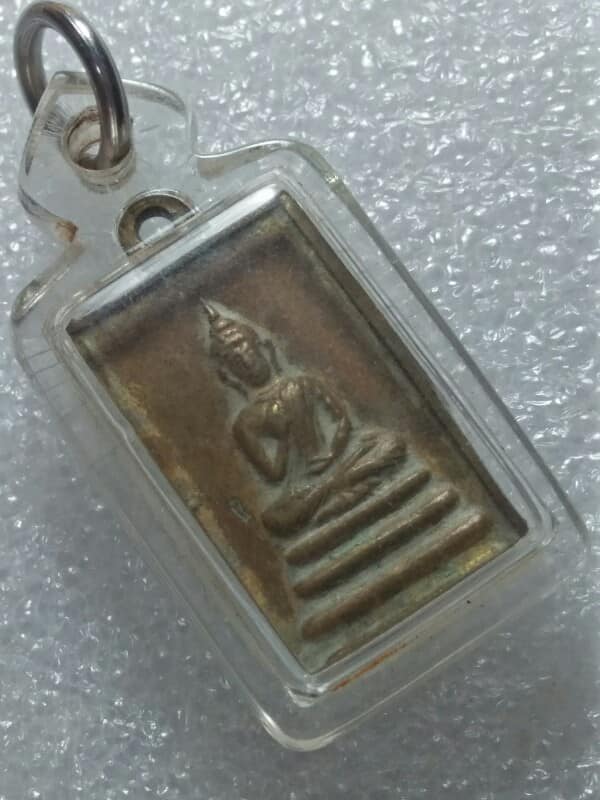 เหรียญพระพุทธหลังยันต์ เลี่ยมพลาสติก ไม่ทราบวัด