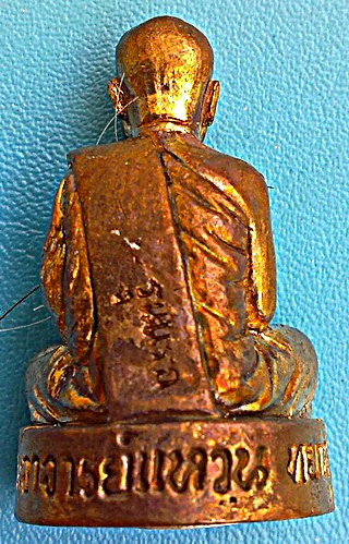 พระกริ่งรูปเหมือนหัวหลิมเศรษฐี รุ่นแรก หลวงตาแหวน ทยาลุโก เนื้อพิเศษ นวะก้นเงิน ติดเกศา จีวร หายาก