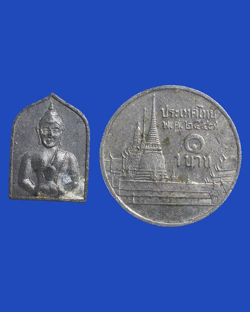 เหรียญพระพุทธครึ่งองค์ เนื้อชิน พิมพ์เล็ก