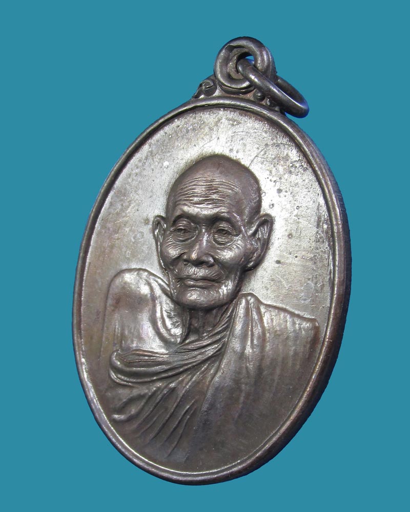 เหรียญรุ่นห้า(ไตรมาส) หลวงปู่แจ้ง วัดใหม่สุนทร โนนสูง ปี2534