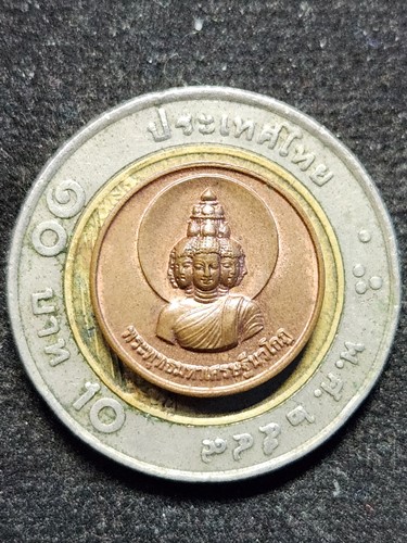 สถาบันพยากรณ์ศาสตร์  เหรียญกลมเล็ก พระพุทธมหาเศรษฐีนวโกฎิ อาจารย์ลักษณ์ เรขานิเทศ 2553