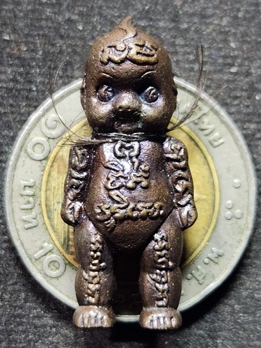 วัดในเตา ตรัง หุ่นพยนต์ อ.ประสูติ ปิยธัมโม รุ่นมงคล9  เนื้อโลหะอาถรรภ์ 