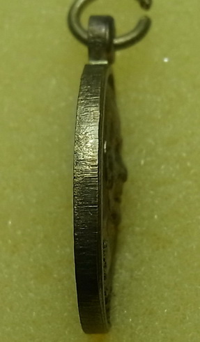 เหรียญหลวงพ่ออุ่นเรือน วัดเจ็ดยอด จ.เชียงราย เนื้อฝาบาตร