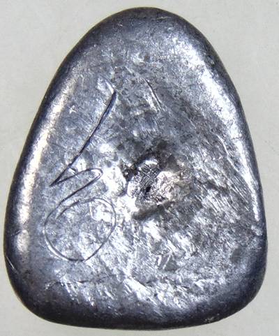 ๒๐ 	พระปิดตา เนื้อตะกั่ว จารหลัง