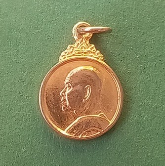 เหรียญหลวงปู่ฝั้น หันข้างหน้าสิงห์ หลังยันต์ดวง ปี 2519