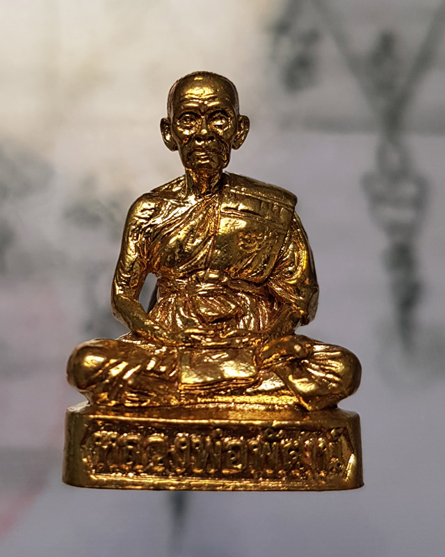 รูปหล่อรุ่น รวยทันใจ ๙๙ หลวงพ่อพัฒน์ วัดห้วยด้วน จ.นครสวรรค์ เนื้อทองทิพย์ก้นชนวน หมายเลข 1828