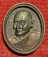 เหรียญหล่อรูปไข่ เนื้อนวะโลหะ หลวงพ่อแพ ชุด100ปี วัดพิกุลทอง ปี35 ตอกโค๊ตด้านหน้า...เคาะเดียวแดง..