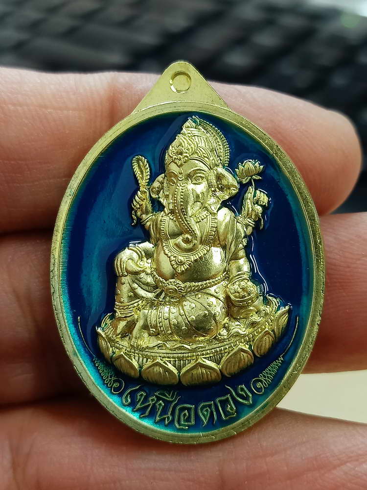 4-555 เหรียญพระพิฆเนศปางเสวยสุข รุ่นเหนือดวง วัดปุดเนียม ศรีสะเกษ 2568 รก.24 เลข 321 กล่องเดิม