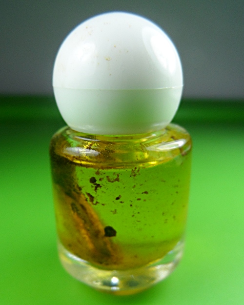 น้ำมันมนต์มหาละลวยใหญ่หลวงปู่สิงห์ วัดบ้านขี้เหล็ก ศรีสะเกษ .B856..