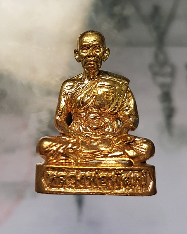 รูปหล่อรุ่น รวยทันใจ ๙๙ หลวงพ่อพัฒน์ วัดห้วยด้วน จ.นครสวรรค์ เนื้อทองทิพย์ก้นชนวน หมายเลข 1803