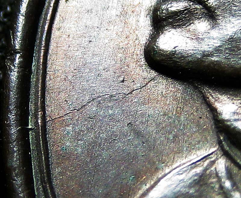 เหรียญไตรมาส รุ่นที่ 2  M 16 หลวงพ่อแพ วัดพิกุลทอง สิงห์บุรี 2513 - 3